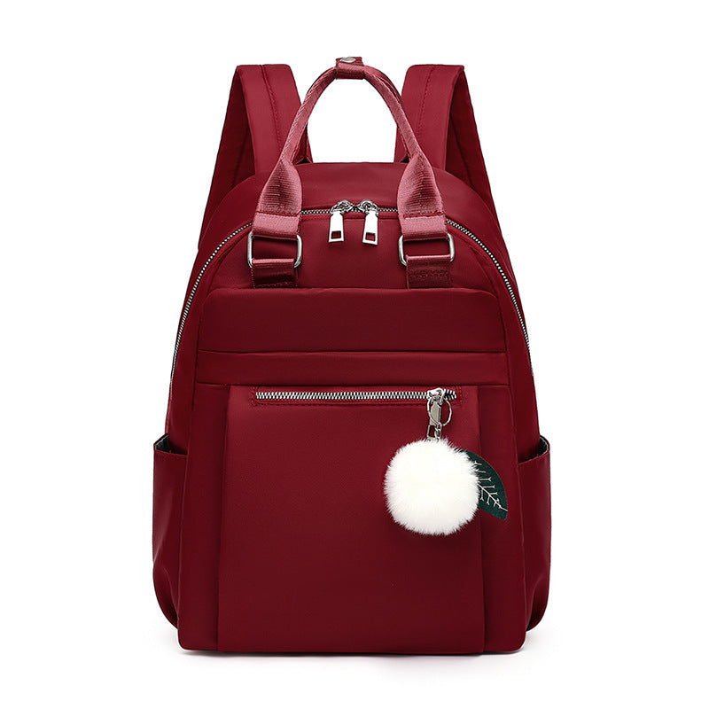Sac à dos collégien avec pompon blanc